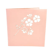 Front cover of card with pink color features Sakura flower