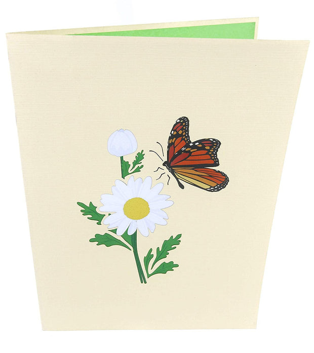 Front cover of card with beige color features monarch butterfly and white daisy flower
